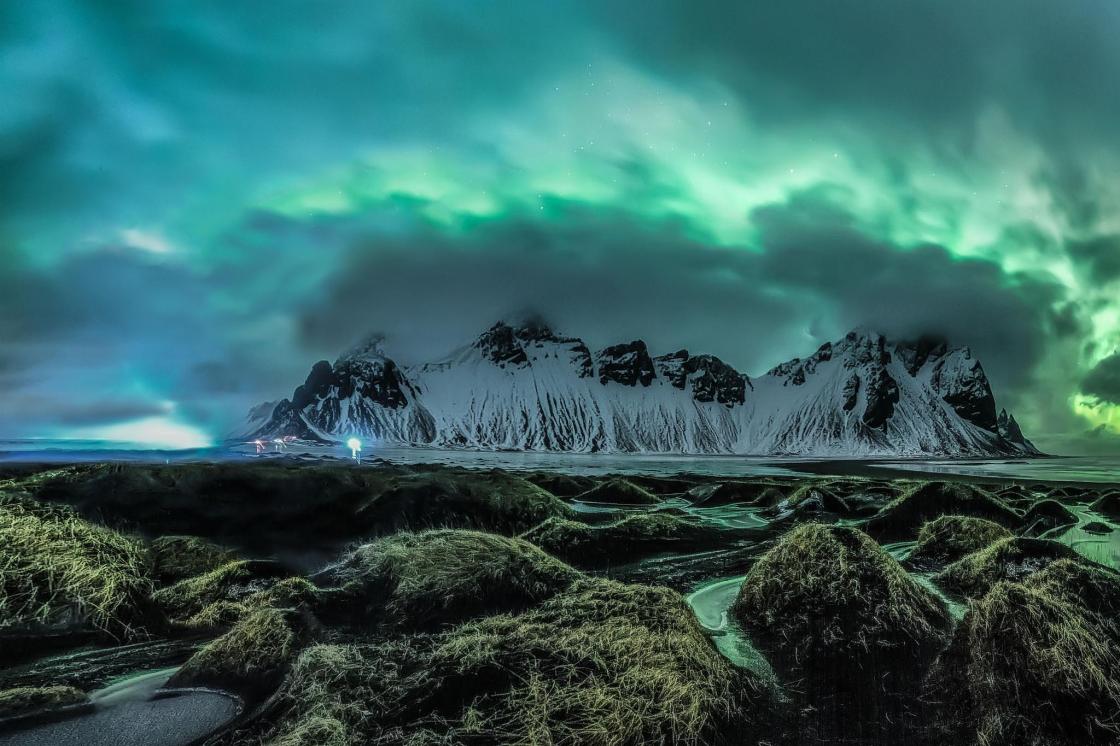 The lights loom over the mountains in Stokknes on the southern coast of Iceland JINGYI ZHANG/ROYAL OBSERVATORY INSIGHT INVESTMENT ASTRONOMY PHOTOGRAPHER OF THE YEAR